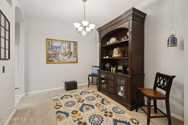 1208 Kyle Way S, Saint Johns, FL 32259 - living area featuring arched walkways, a chandelier, and light carpet