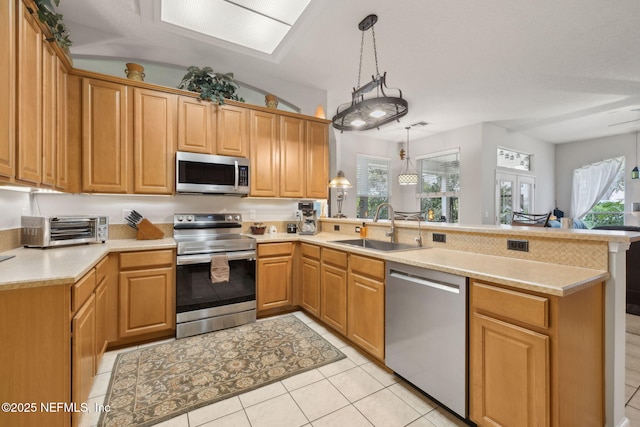 1208 Kyle Way S, Saint Johns, FL 32259 - kitchen with appliances with stainless steel finishes, a peninsula, light countertops, and healthy amount of natural light