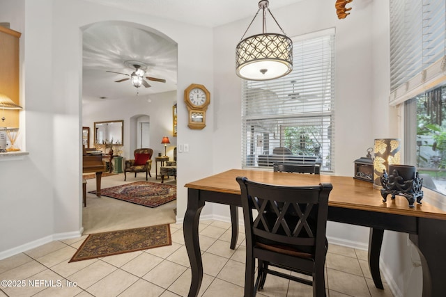 1208 Kyle Way S, Saint Johns, FL 32259 - dining room featuring a ceiling fan, arched walkways, and light tile patterned floors