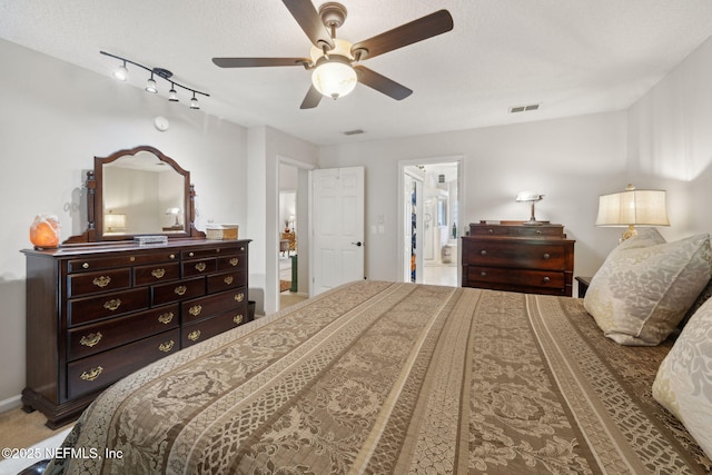 1208 Kyle Way S, Saint Johns, FL 32259 - bedroom with ensuite bathroom, a ceiling fan, and a textured ceiling