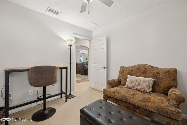 1208 Kyle Way S, Saint Johns, FL 32259 - sitting room with carpet, a textured ceiling, arched walkways, and ceiling fan