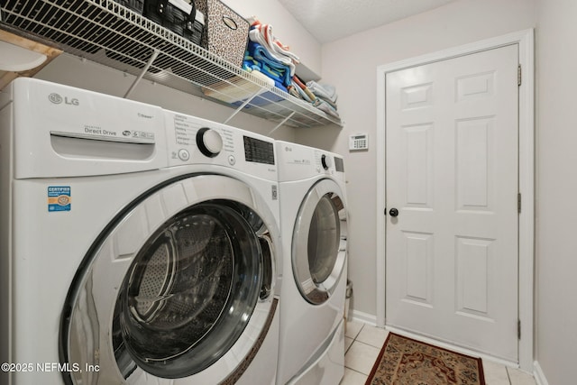 1208 Kyle Way S, Saint Johns, FL 32259 - laundry room featuring washing machine and dryer and light tile patterned floors