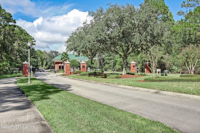 1208 Kyle Way S, Saint Johns, FL 32259 - view of asphalt street with street lighting, curbs, and a gated entry