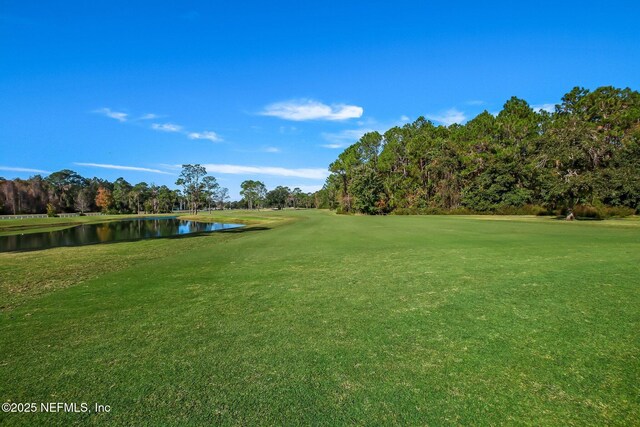 1208 Kyle Way S, Saint Johns, FL 32259 - view of community featuring a water view, a yard, golf course view, and view of wooded area