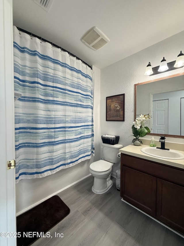 106 Sunrise Ct, Atlantic Beach, FL 32233 - full bathroom with vanity, wood finished floors, shower / bathtub combination with curtain, and a textured wall