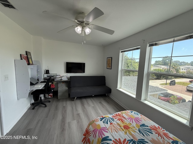 106 Sunrise Ct, Atlantic Beach, FL 32233 - bedroom featuring an office area, wood finished floors, and a ceiling fan