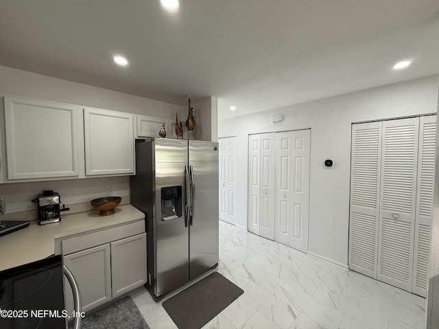106 Sunrise Ct, Atlantic Beach, FL 32233 - kitchen featuring stainless steel refrigerator with ice dispenser, light marble finish flooring, range with electric cooktop, light countertops, and recessed lighting