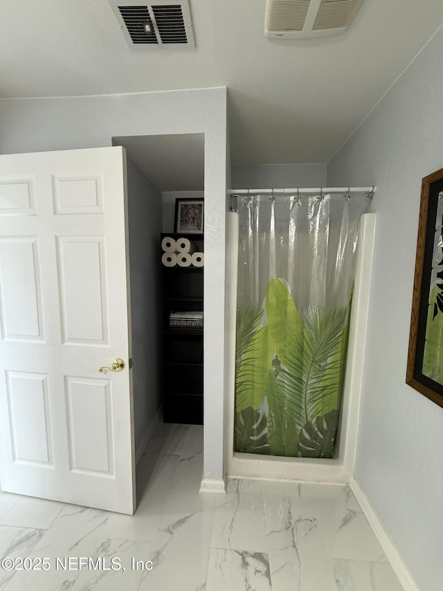 106 Sunrise Ct, Atlantic Beach, FL 32233 - bathroom with marble look tile flooring and curtained shower