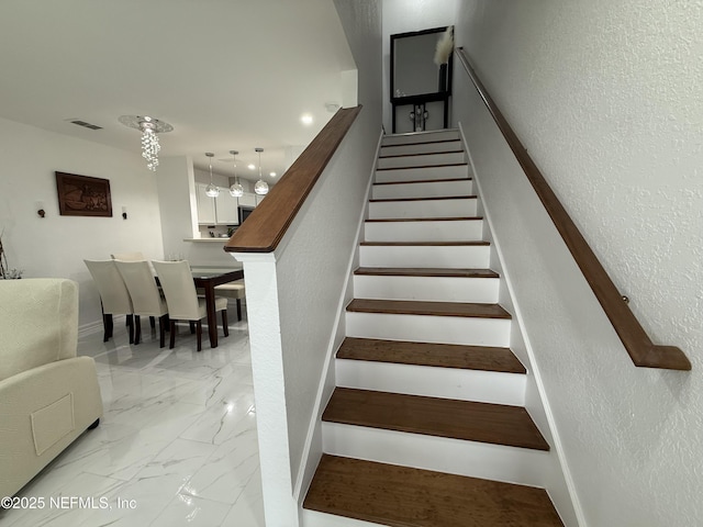 106 Sunrise Ct, Atlantic Beach, FL 32233 - stairway featuring marble finish flooring and a textured wall