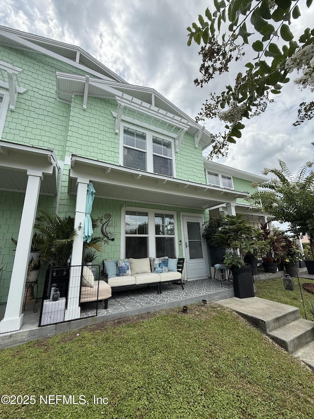 106 Sunrise Ct, Atlantic Beach, FL 32233 - view of front of home with an outdoor hangout area and a patio