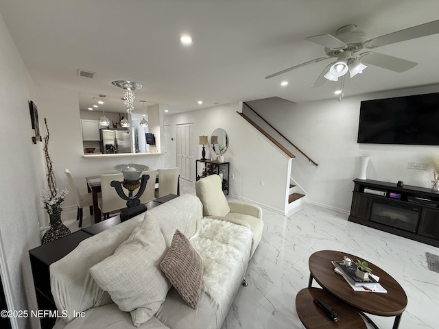 106 Sunrise Ct, Atlantic Beach, FL 32233 - living room featuring a ceiling fan, marble look tile flooring, stairs, and recessed lighting