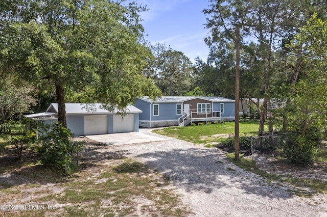 2254 Stauffer Rd, Green Cove Springs, FL 32043 - view of front of home with gravel driveway and a garage
