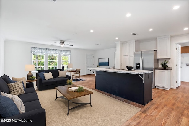 2254 Stauffer Rd, Green Cove Springs, FL 32043 - living room with light wood-type flooring, recessed lighting, a ceiling fan, and crown molding