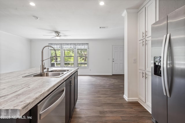 2254 Stauffer Rd, Green Cove Springs, FL 32043 - kitchen featuring appliances with stainless steel finishes, crown molding, a ceiling fan, white cabinets, and recessed lighting