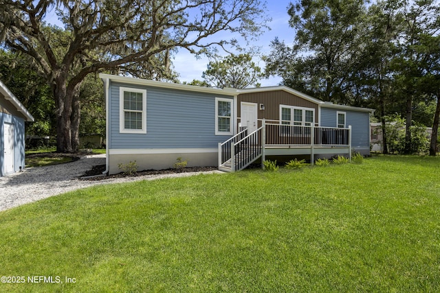 2254 Stauffer Rd, Green Cove Springs, FL 32043 - view of front of property featuring a wooden deck and a front yard