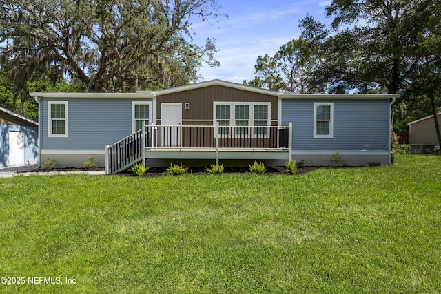 2254 Stauffer Rd, Green Cove Springs, FL 32043 - view of front facade with a deck and a front yard