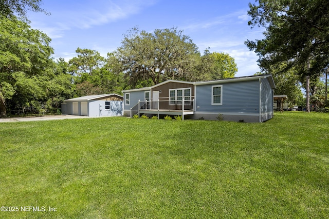 2254 Stauffer Rd, Green Cove Springs, FL 32043 - view of front of property featuring a deck, an outdoor structure, a front lawn, and concrete driveway