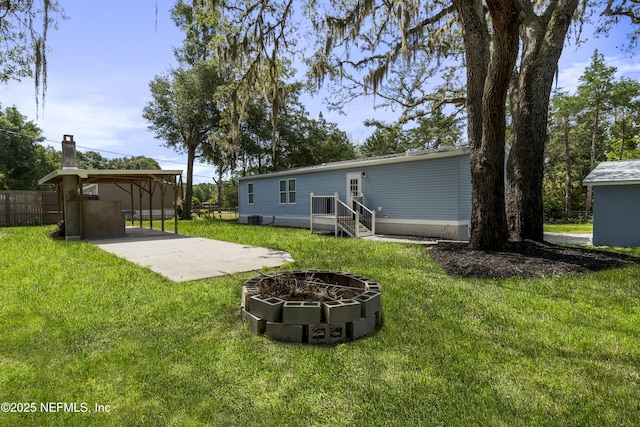 2254 Stauffer Rd, Green Cove Springs, FL 32043 - view of yard with a detached carport and an outdoor fire pit