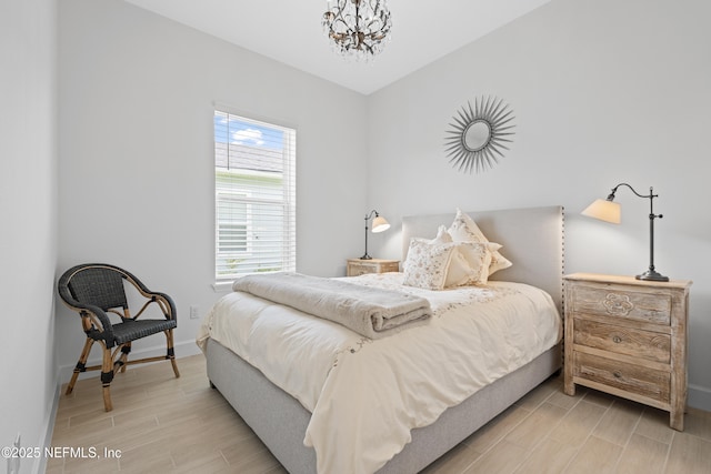 985 Rustic Mill Dr, Saint Augustine, FL 32092 - bedroom featuring light wood-style floors and a chandelier
