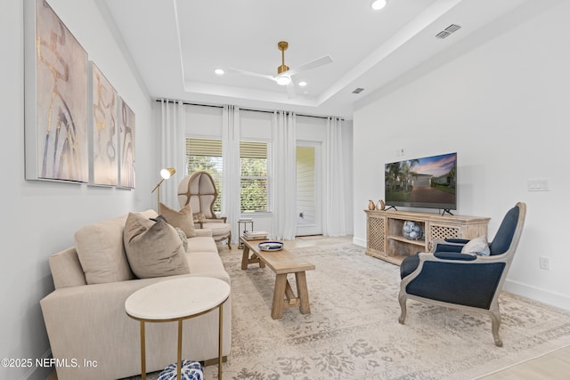 985 Rustic Mill Dr, Saint Augustine, FL 32092 - living room featuring a ceiling fan, recessed lighting, and a tray ceiling