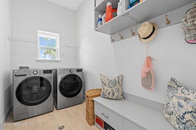 985 Rustic Mill Dr, Saint Augustine, FL 32092 - laundry area with washer and clothes dryer and wood finish floors