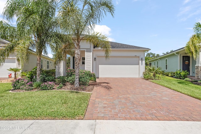 985 Rustic Mill Dr, Saint Augustine, FL 32092 - view of front of home featuring decorative driveway, a front lawn, and a garage
