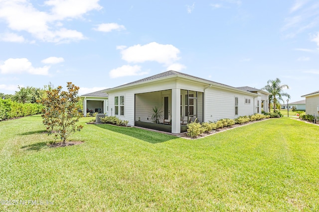 985 Rustic Mill Dr, Saint Augustine, FL 32092 - rear view of property with a lawn and a sunroom