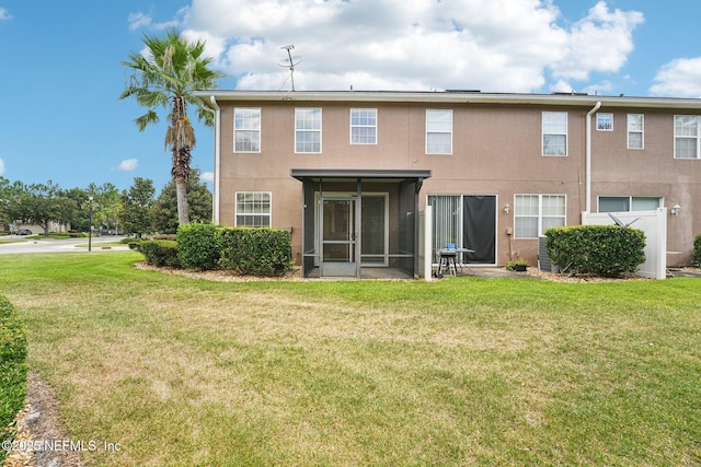 3905 Buckthorne Dr Unit D, Orange Park, FL 32065 - back of property with a yard, a sunroom, and stucco siding