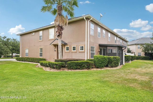 3905 Buckthorne Dr Unit D, Orange Park, FL 32065 - view of home's exterior featuring stucco siding and a yard