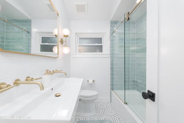 411 S St, Neptune Beach, FL 32266 - full bathroom with tile patterned flooring, bath / shower combo with glass door, and vanity