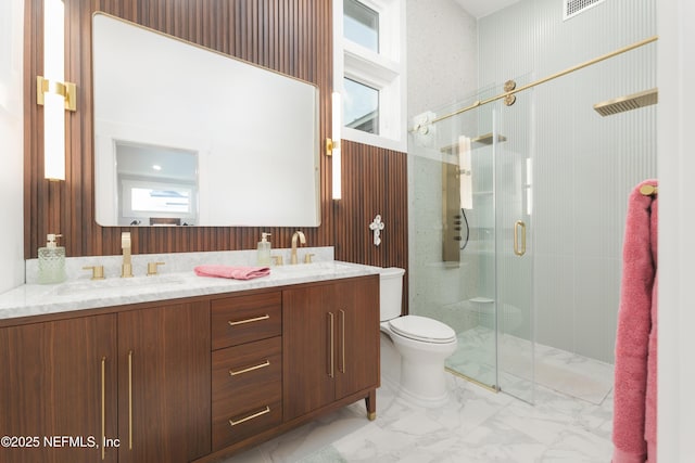 411 S St, Neptune Beach, FL 32266 - full bathroom with marble finish flooring, a shower stall, and double vanity