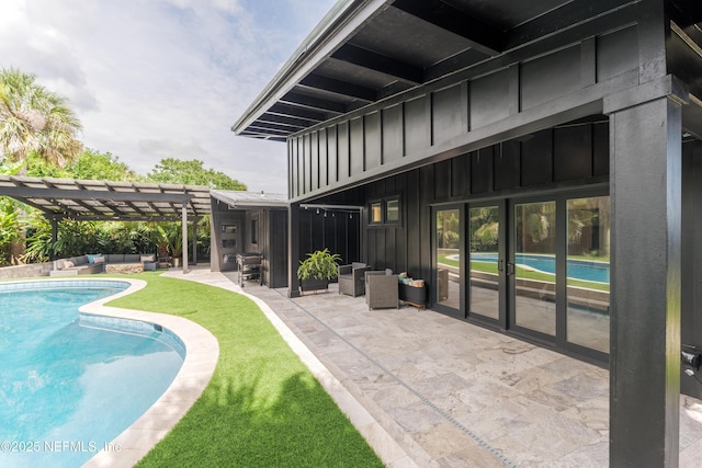 411 S St, Neptune Beach, FL 32266 - outdoor pool with a pergola, an outdoor living space, and a patio area