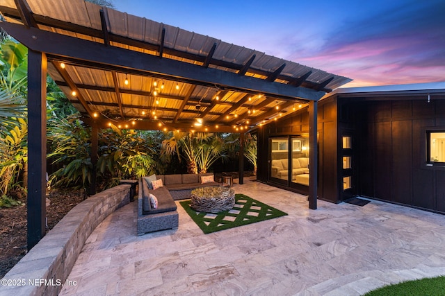 411 S St, Neptune Beach, FL 32266 - patio terrace at dusk featuring a patio and an outdoor hangout area