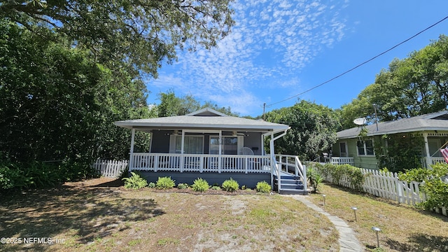 1319 Hickory St, Fernandina Beach, FL 32034 - view of front facade featuring covered porch
