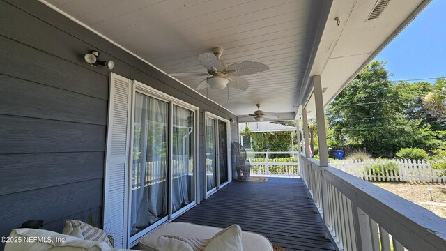 1319 Hickory St, Fernandina Beach, FL 32034 - wooden porch with ceiling fan