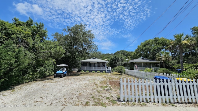 1319 Hickory St, Fernandina Beach, FL 32034 - view of front of house featuring a sunroom