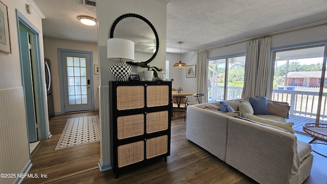 1319 Hickory St, Fernandina Beach, FL 32034 - living area featuring a textured ceiling and dark wood-type flooring