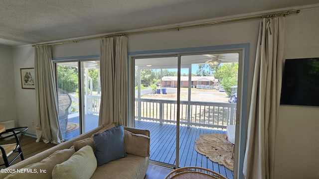 1319 Hickory St, Fernandina Beach, FL 32034 - living area featuring wood finished floors, a textured ceiling, and ceiling fan