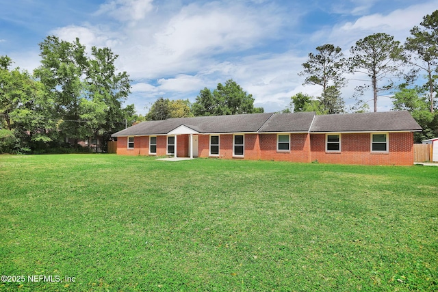 11707 Village Ln, Jacksonville, FL 32223 - single story home with a front yard and brick siding