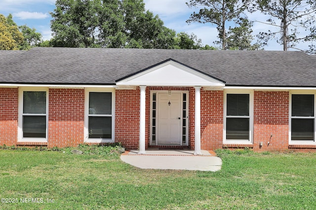 11707 Village Ln, Jacksonville, FL 32223 - single story home with a shingled roof, a front lawn, and brick siding