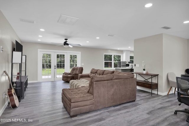 11707 Village Ln, Jacksonville, FL 32223 - living area with light wood-style flooring, recessed lighting, healthy amount of natural light, and a ceiling fan