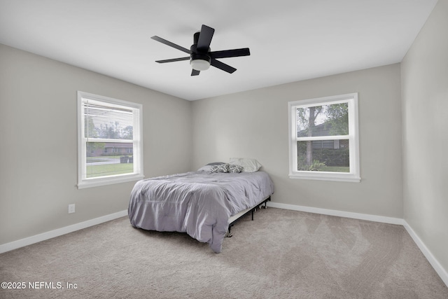 11707 Village Ln, Jacksonville, FL 32223 - carpeted bedroom with baseboards and ceiling fan