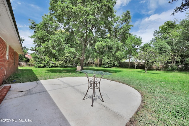 11707 Village Ln, Jacksonville, FL 32223 - fenced backyard featuring a patio area