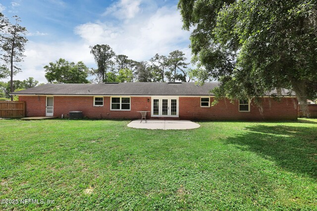 11707 Village Ln, Jacksonville, FL 32223 - rear view of property featuring french doors, a patio, and brick siding