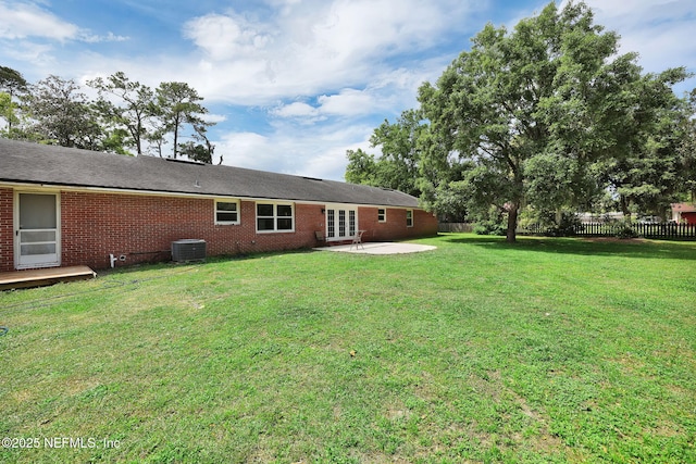 11707 Village Ln, Jacksonville, FL 32223 - rear view of house with french doors, a patio, and brick siding