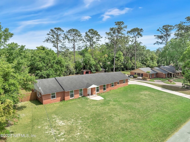 11707 Village Ln, Jacksonville, FL 32223 - view of front of house featuring a shingled roof, brick siding, and concrete driveway