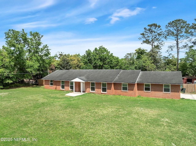11707 Village Ln, Jacksonville, FL 32223 - single story home with view of wooded area, brick siding, and roof with shingles