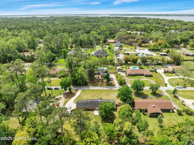 11707 Village Ln, Jacksonville, FL 32223 - aerial perspective of suburban area featuring a forest and a nearby body of water
