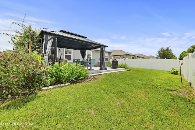 2264 Pebble Point Dr, Green Cove Springs, FL 32043 - rear view of property featuring a gazebo, a fenced backyard, a patio, and a metal roof