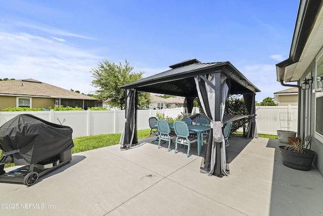 2264 Pebble Point Dr, Green Cove Springs, FL 32043 - fenced backyard with a gazebo, outdoor dining area, a patio, and area for grilling